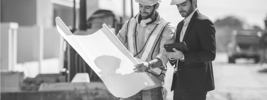 Illustration of construction managers reviewing project tracking software to reduce claims and disputes.